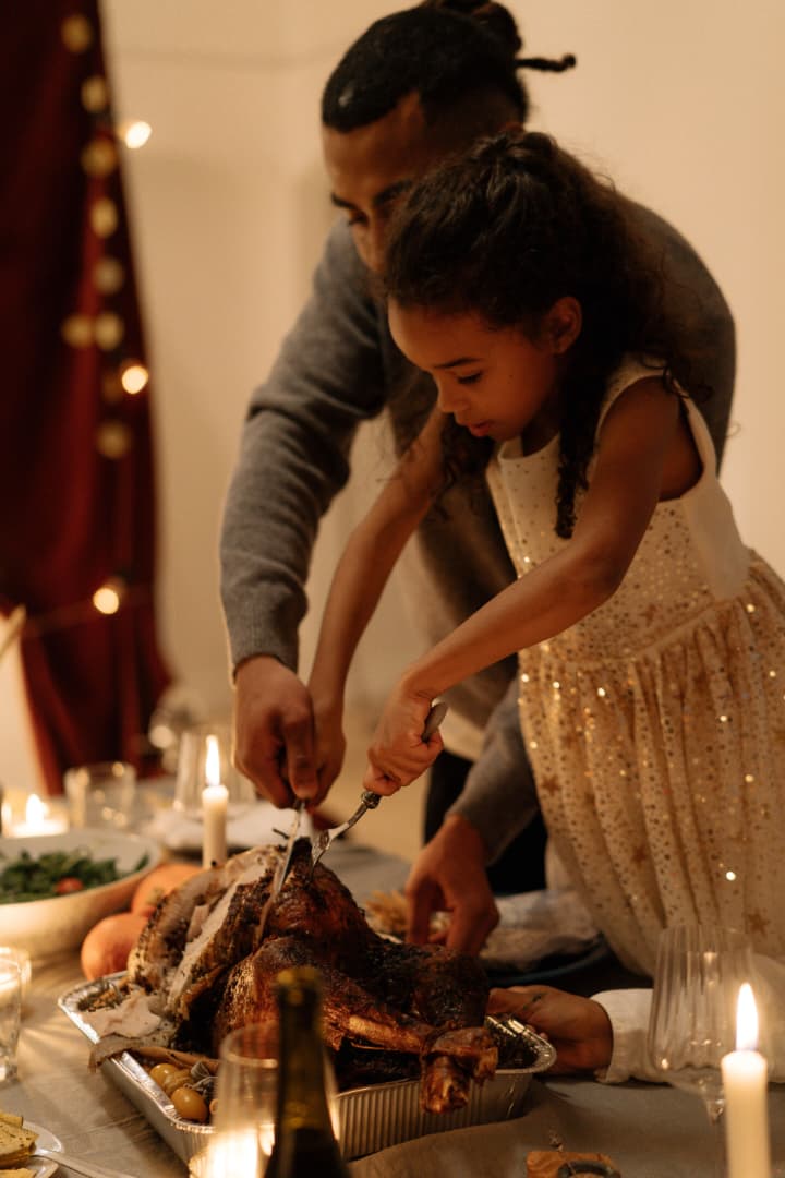 A child celebrating with a holiday meal